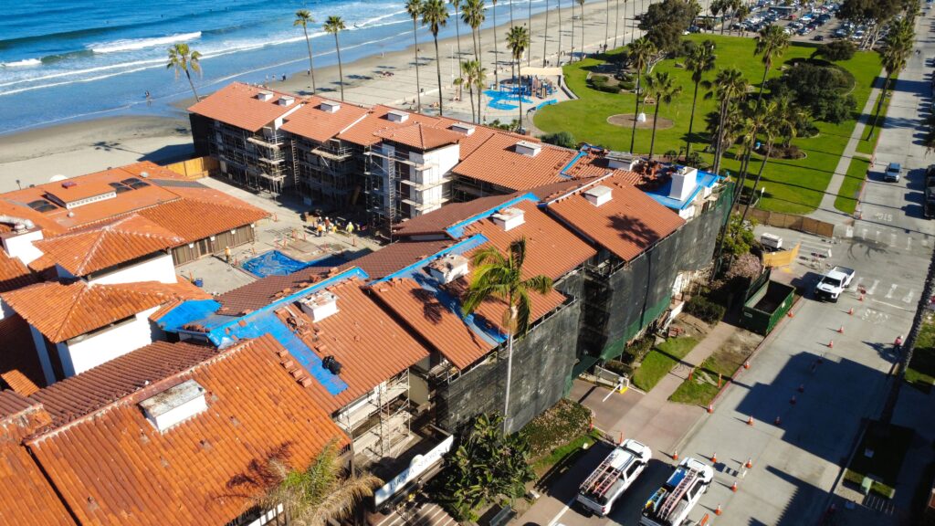 Aerial view of beachfront buildings with red roofs