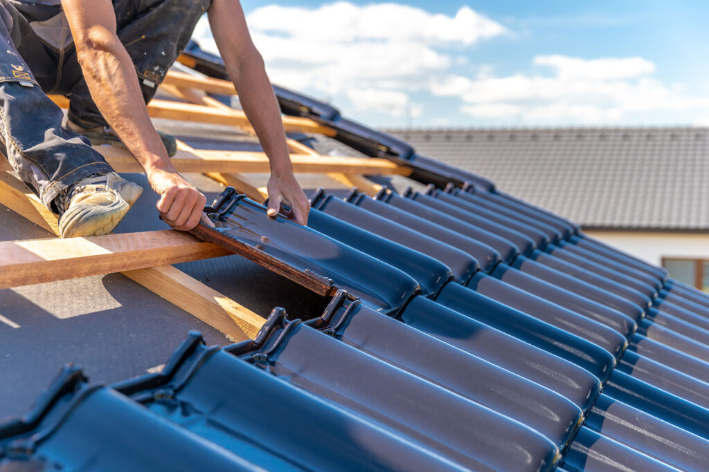 AOS Roof installing shingles on a roof