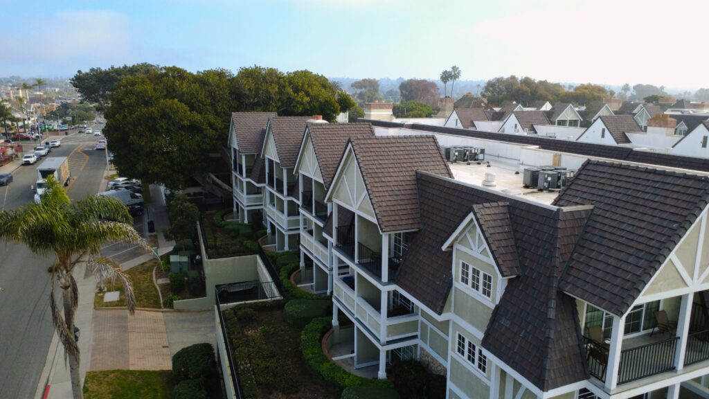 Aerial view of apartment buildings with pitched roofs