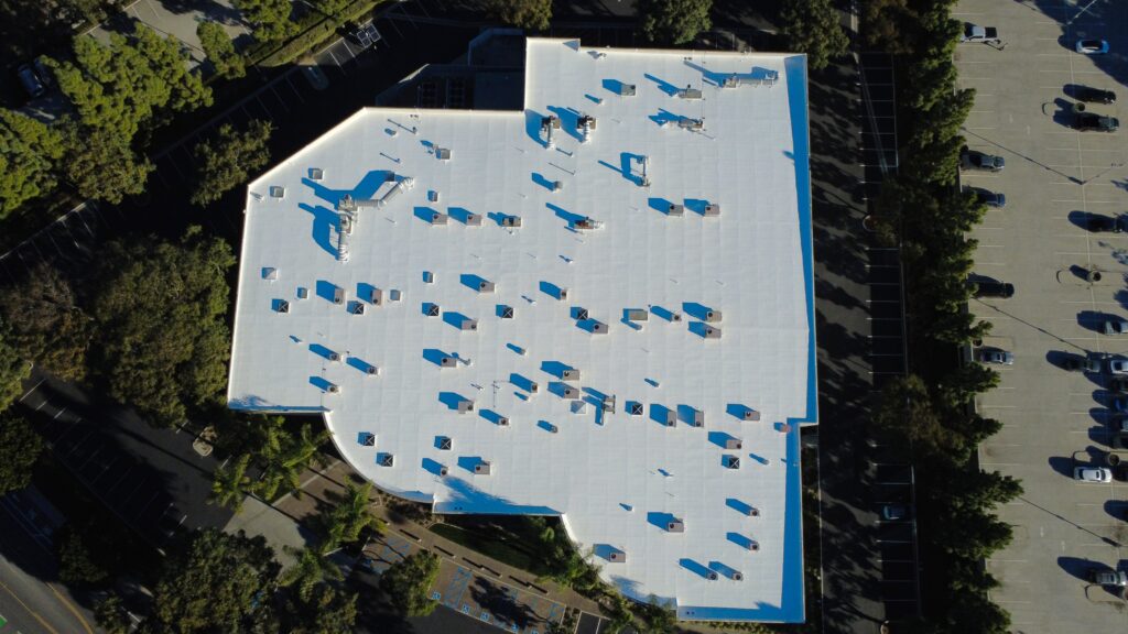 Aerial view of white commercial building roof