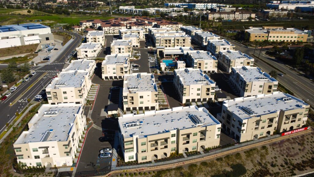 Now leasing banner on apartment facade