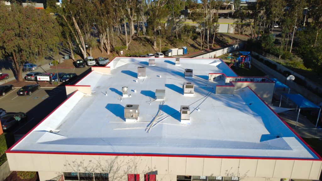 Drone shot showing rooftop vents and playground