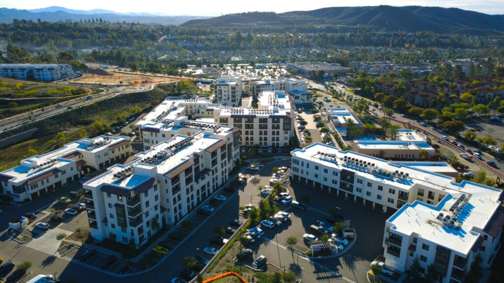 Hillside apartment complex with pools