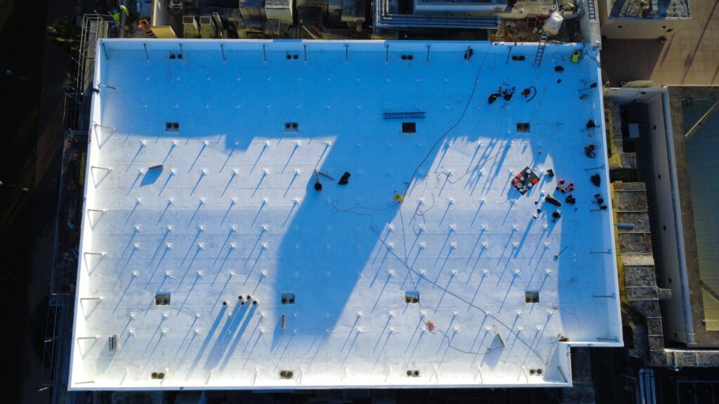 Aerial top-down view of white flat roof