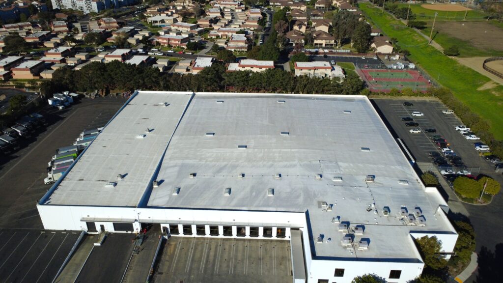 Warehouse rooftop showing loading docks and trucks