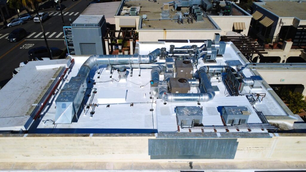 Commercial rooftop with HVAC ductwork and units